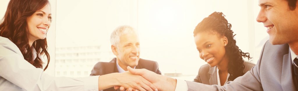 Young Executive Woman And A Colleague Shaking Hands